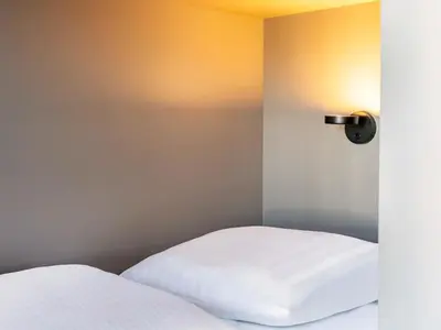 Ein Bett oder Betten in einem Zimmer der Unterkunft B&B HOTEL München-Messe