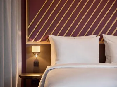 Ein Bett oder Betten in einem Zimmer der Unterkunft B&B HOTEL München-Messe