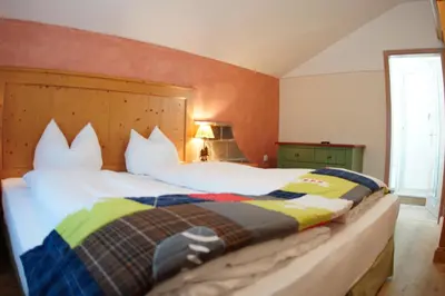 Ein Bett oder Betten in einem Zimmer der Unterkunft Landkomforthotel Panorama & Restaurant Bella Vista