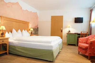 Ein Bett oder Betten in einem Zimmer der Unterkunft Landkomforthotel Panorama & Restaurant Bella Vista