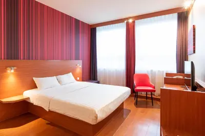 Ein Bett oder Betten in einem Zimmer der Unterkunft Star G Hotel München Schwabing