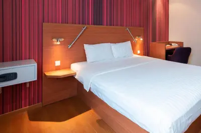 Ein Bett oder Betten in einem Zimmer der Unterkunft Star G Hotel München Schwabing