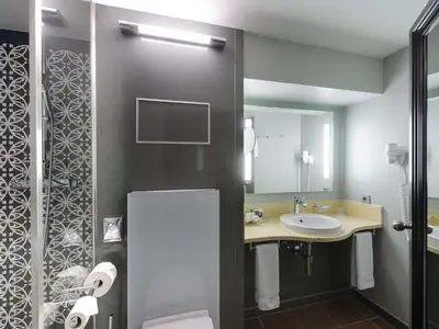 Ein Badezimmer in der Unterkunft Mercure München City Center