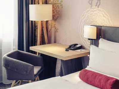 Ein Bett oder Betten in einem Zimmer der Unterkunft Mercure München City Center