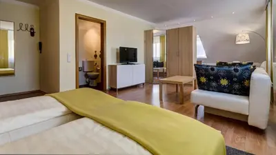 Ein Bett oder Betten in einem Zimmer der Unterkunft Hotel Restaurant Weihenstephaner Stuben