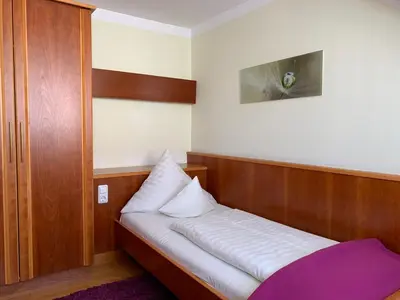 Ein Bett oder Betten in einem Zimmer der Unterkunft Hotel Restaurant Weihenstephaner Stuben