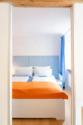 Ein Bett oder Betten in einem Zimmer der Unterkunft Ferienwohnung in der Kirchgasse