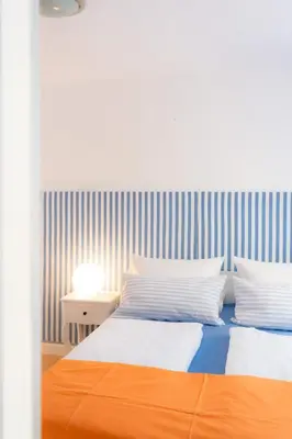 Ein Bett oder Betten in einem Zimmer der Unterkunft Ferienwohnung in der Kirchgasse