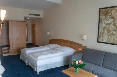 Ein Bett oder Betten in einem Zimmer der Unterkunft Hotel Daniel