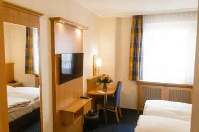 Ein Bett oder Betten in einem Zimmer der Unterkunft Hotel Daniel
