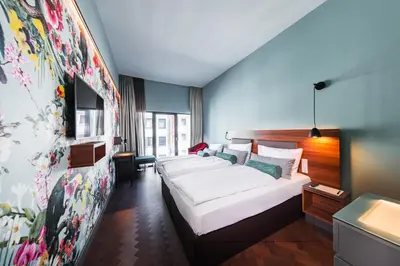 Ein Bett oder Betten in einem Zimmer der Unterkunft Maison Schiller by DesignCity Hotels