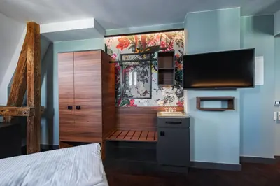 TV/Unterhaltungsangebot in der Unterkunft Maison Schiller by DesignCity Hotels