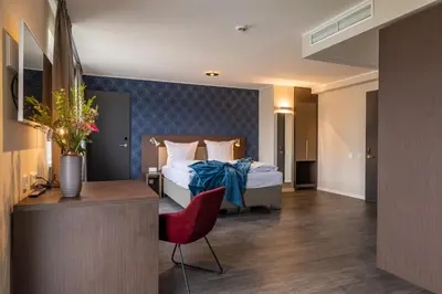 Ein Bett oder Betten in einem Zimmer der Unterkunft MASEVEN München Messe Trudering