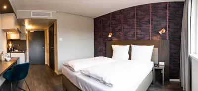 Ein Bett oder Betten in einem Zimmer der Unterkunft MASEVEN München Messe Trudering