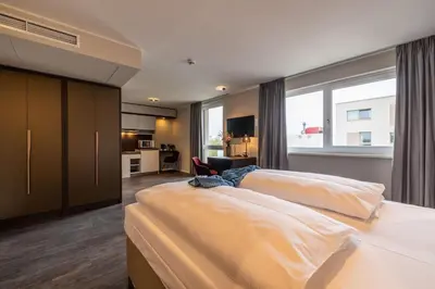 Ein Bett oder Betten in einem Zimmer der Unterkunft MASEVEN München Messe Trudering