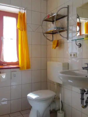 Ein Badezimmer in der Unterkunft Pension Poschmühle