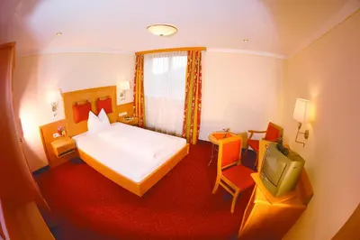 Ein Bett oder Betten in einem Zimmer der Unterkunft Gasthof Messerschmied