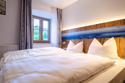 Ein Bett oder Betten in einem Zimmer der Unterkunft Gasthof Messerschmied