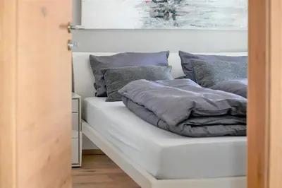 Ein Bett oder Betten in einem Zimmer der Unterkunft Apartment BergArt