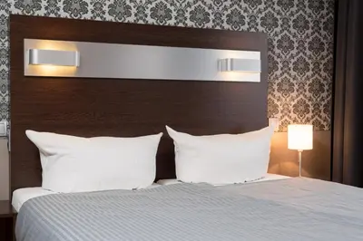 Ein Bett oder Betten in einem Zimmer der Unterkunft Hotel Munich Inn - Design Hotel