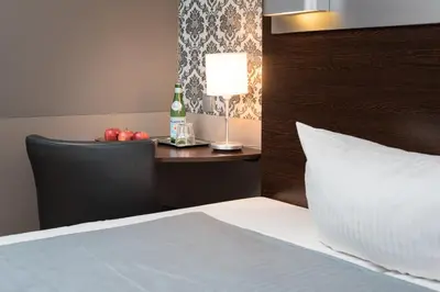 Ein Bett oder Betten in einem Zimmer der Unterkunft Hotel Munich Inn - Design Hotel