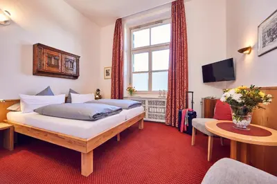 Ein Bett oder Betten in einem Zimmer der Unterkunft Hotel Aschenbrenner