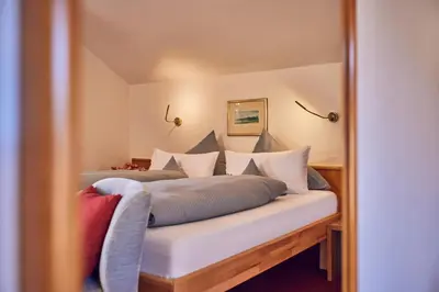 Ein Bett oder Betten in einem Zimmer der Unterkunft Hotel Aschenbrenner