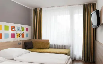 Ein Bett oder Betten in einem Zimmer der Unterkunft Business & Budget Hotel Tessin