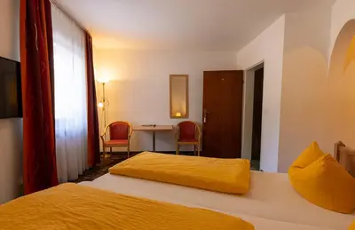 Ein Bett oder Betten in einem Zimmer der Unterkunft Hotel Alpenhof