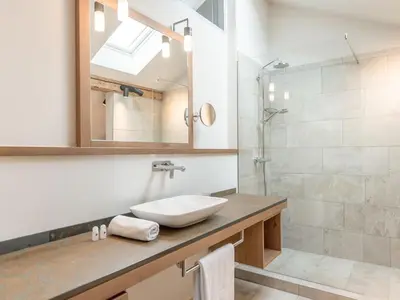 Ein Badezimmer in der Unterkunft Schneiderwirt