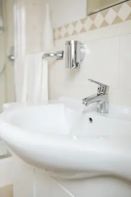 Ein Badezimmer in der Unterkunft Tegernseer Hof