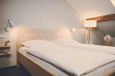 Ein Bett oder Betten in einem Zimmer der Unterkunft Der Lederer Hof - Boutique Apartments