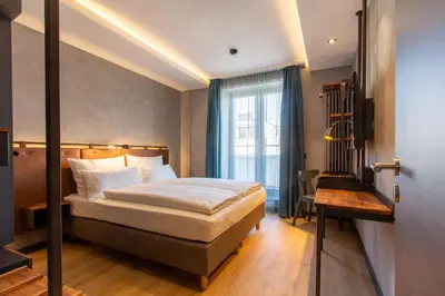 Ein Bett oder Betten in einem Zimmer der Unterkunft Unsöld's Factory Hotel