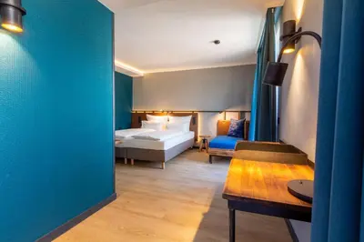 Ein Bett oder Betten in einem Zimmer der Unterkunft Unsöld's Factory Hotel