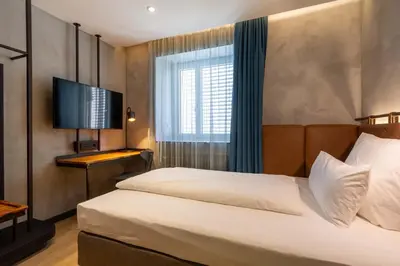 Ein Bett oder Betten in einem Zimmer der Unterkunft Unsöld's Factory Hotel