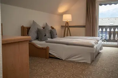 Ein Bett oder Betten in einem Zimmer der Unterkunft Hotel Gasthof Alter Wirt