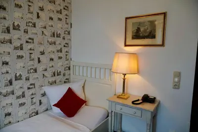 Ein Bett oder Betten in einem Zimmer der Unterkunft Hotel Endorfer Hof