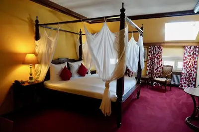 Ein Bett oder Betten in einem Zimmer der Unterkunft Hotel Endorfer Hof