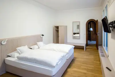Ein Bett oder Betten in einem Zimmer der Unterkunft Gästehaus der Katholischen Akademie in Bayern