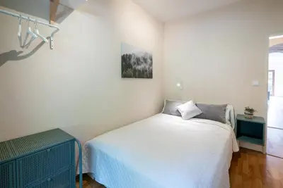 Ein Bett oder Betten in einem Zimmer der Unterkunft 3-Zimmer-Rückzugsort mit Panoramabalkon in Bestlage