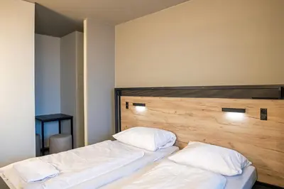 Ein Bett oder Betten in einem Zimmer der Unterkunft a&o München Hackerbrücke