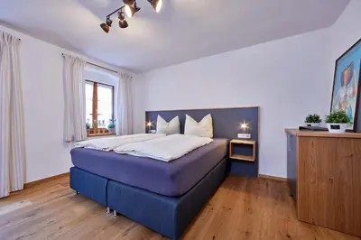 Ein Bett oder Betten in einem Zimmer der Unterkunft FEWO Wamberg