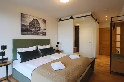 Ein Bett oder Betten in einem Zimmer der Unterkunft Naturhotel Wittelsbach