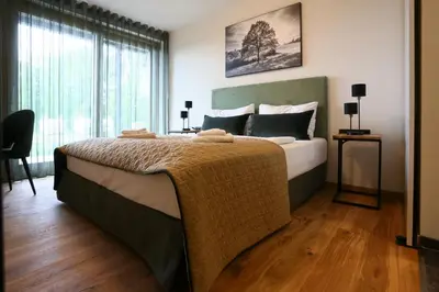 Ein Bett oder Betten in einem Zimmer der Unterkunft Naturhotel Wittelsbach