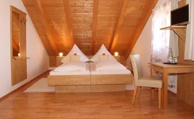 Ein Bett oder Betten in einem Zimmer der Unterkunft Gästehaus Burgmayr