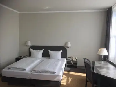 Ein Bett oder Betten in einem Zimmer der Unterkunft Hotel Wörth
