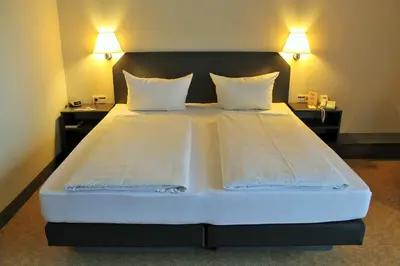 Ein Bett oder Betten in einem Zimmer der Unterkunft Hotel Wörth
