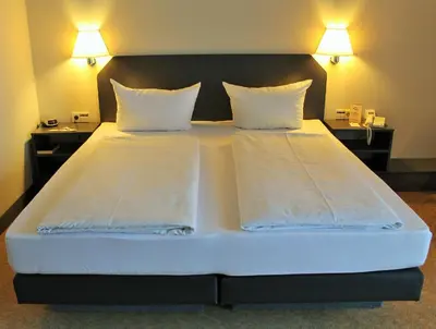 Ein Bett oder Betten in einem Zimmer der Unterkunft Hotel Wörth