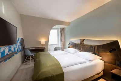 Ein Bett oder Betten in einem Zimmer der Unterkunft ibis Styles Rosenheim