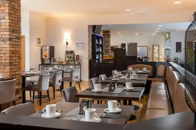 Ein Sitzbereich in der Unterkunft ibis Styles Rosenheim